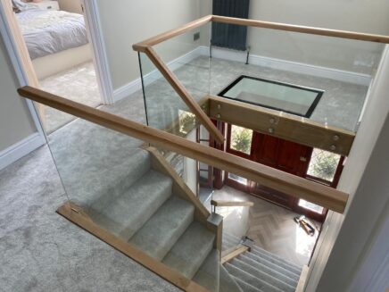 Glass Stair balustrade with oak handrail