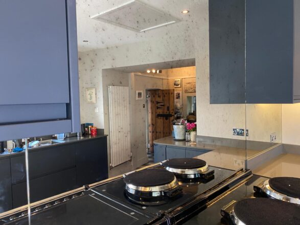 Glass splashback in kitchen